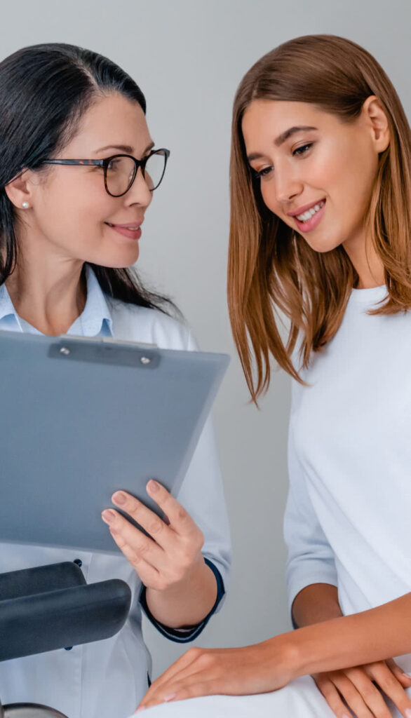 A female healthcare provider discussing care with a female patient