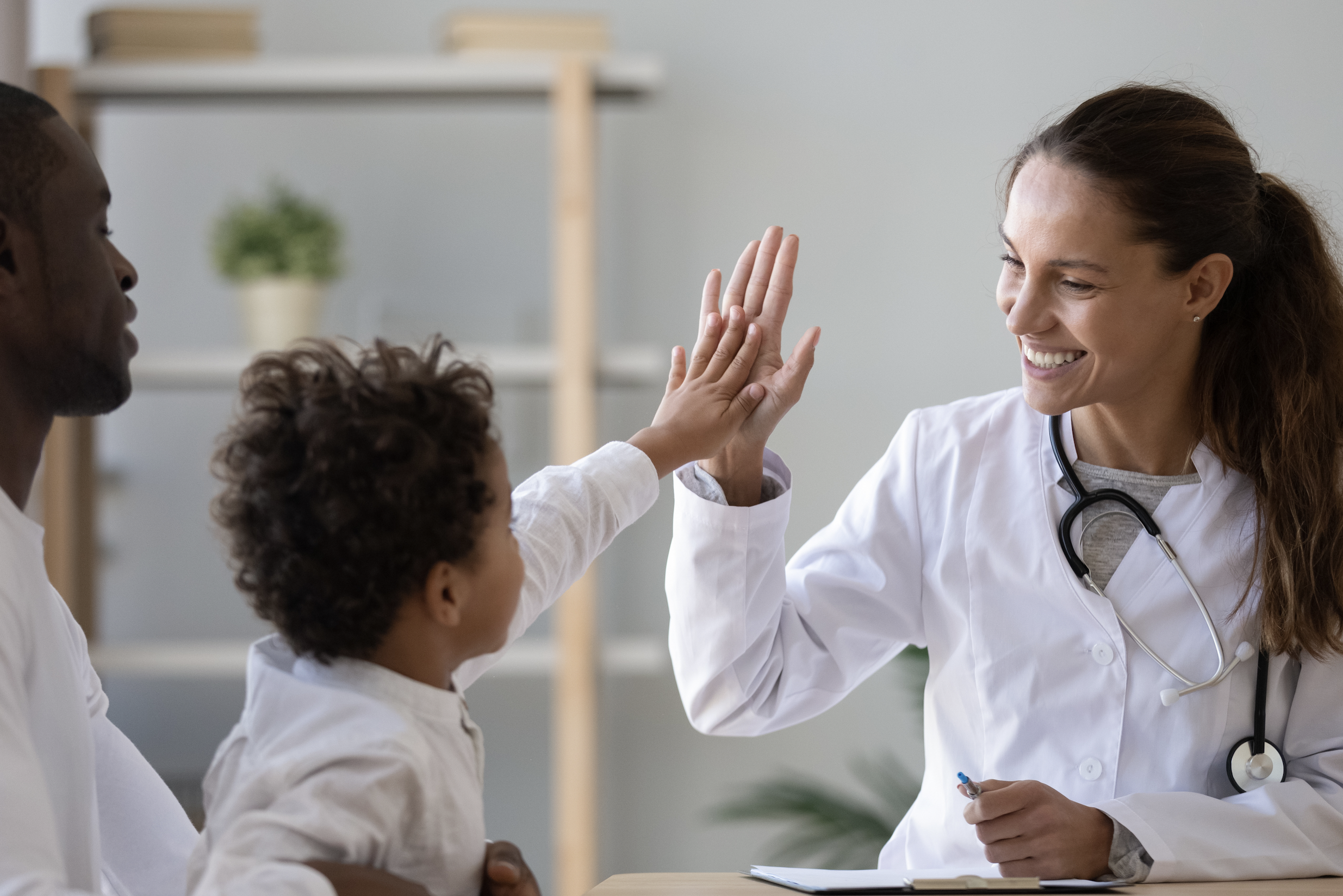 Image for smiling doctor with child